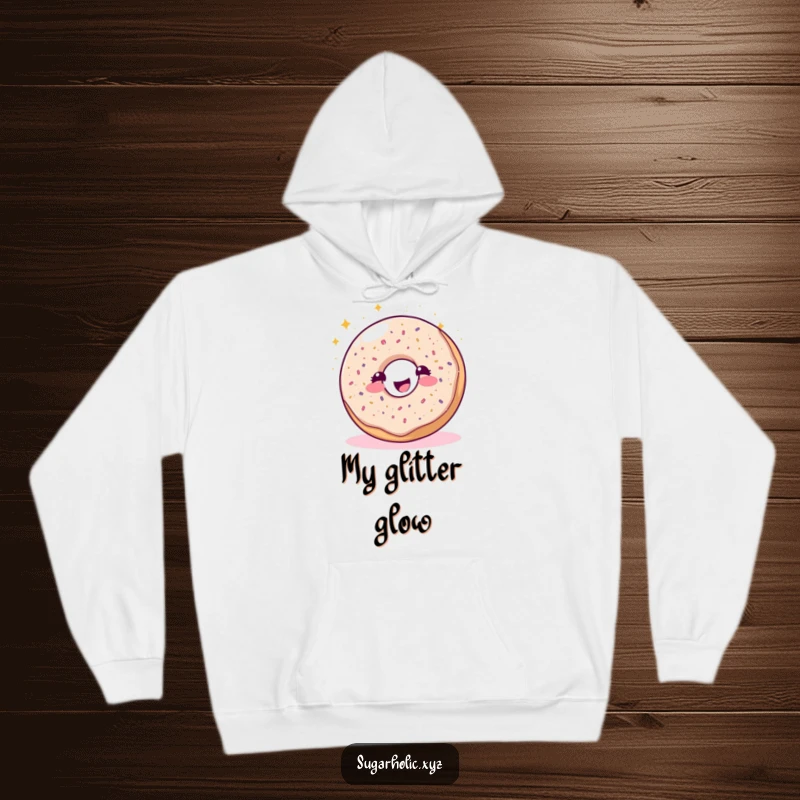 Funny sparkling donut character joyfully sprinkling glitter on a soft hoodie, embodying sweet dreams and warmth.