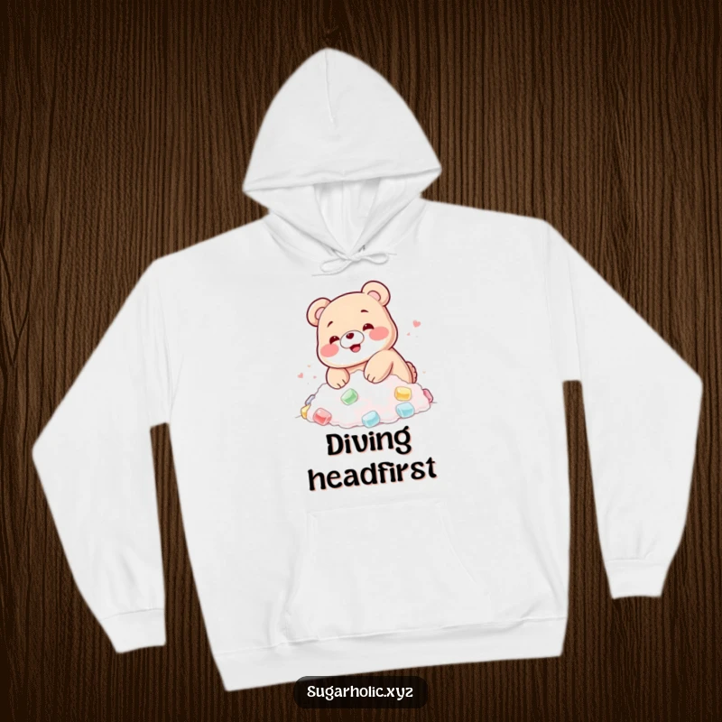 Funny hoodie featuring a blushing gummy bear happily diving into a pile of sugar, cozy and sweet.