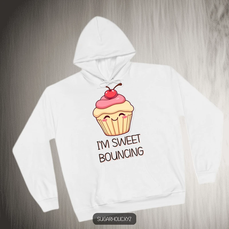Funny bouncing cupcake hoodie showcasing a happy cupcake with a cherry on top, caught mid-bounce with pure delight, a cozy and humorous garment.