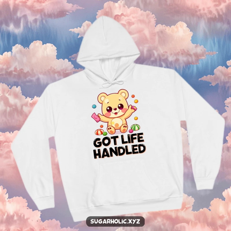 Funny hoodie featuring a beaming gummy bear with oversized eyes, energetically juggling a cascade of colorful candies.