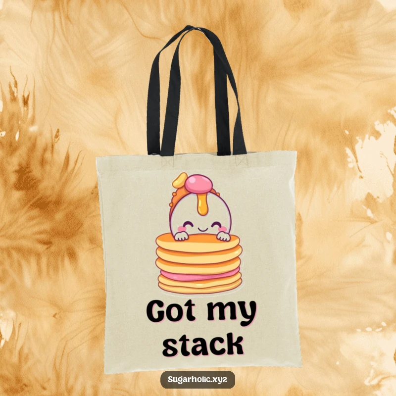 Funny tote bag with a cheerful candy character peeking from behind a stack of pancakes, great for carrying treats.